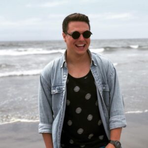 A picture of Brian Gialtketsis laughing on the beach