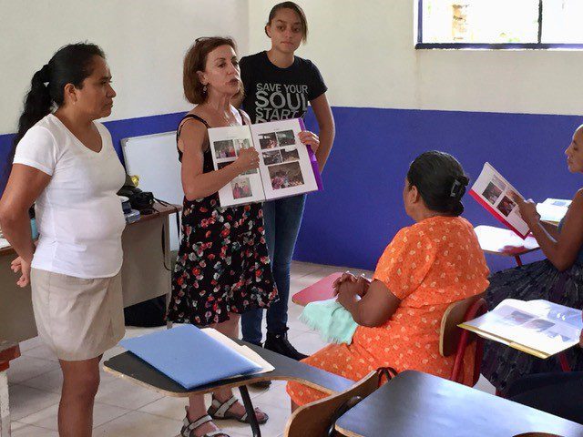 VCCF Donor Client Terri Lisagor teaching a class of Qʼeqchiʼ villagers in Guatemala about nutrition and oral hygiene