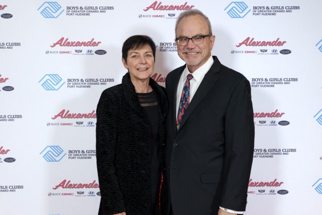 Gwen and Sean Leonard standing and smiling at a Boys & Girls Club Event