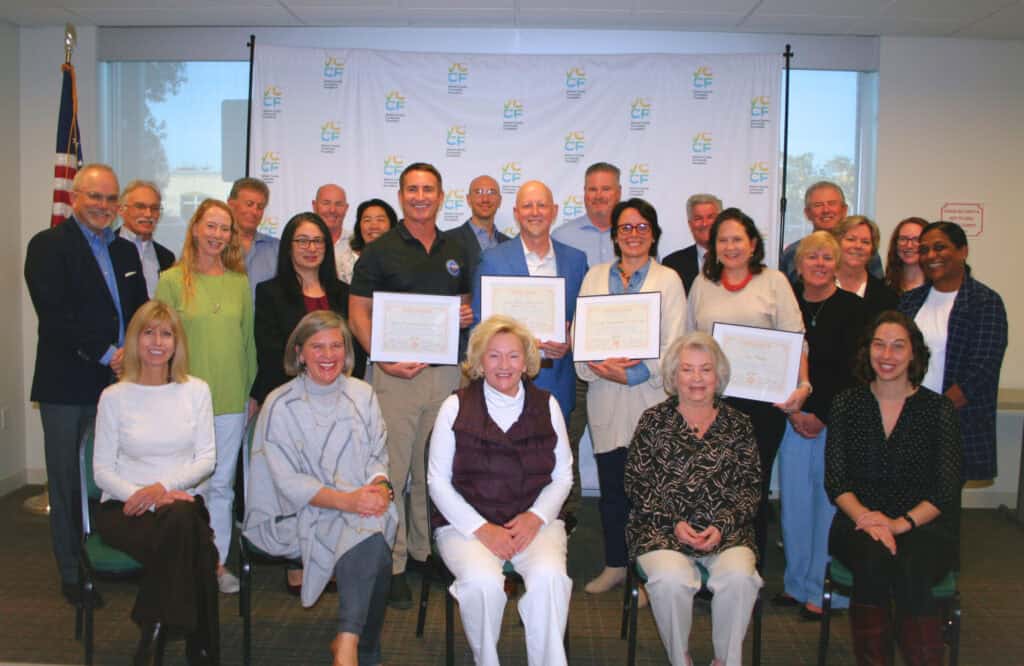 The VCCF Board and staff standing at the certificate presentation with partners during the Mountain Fire